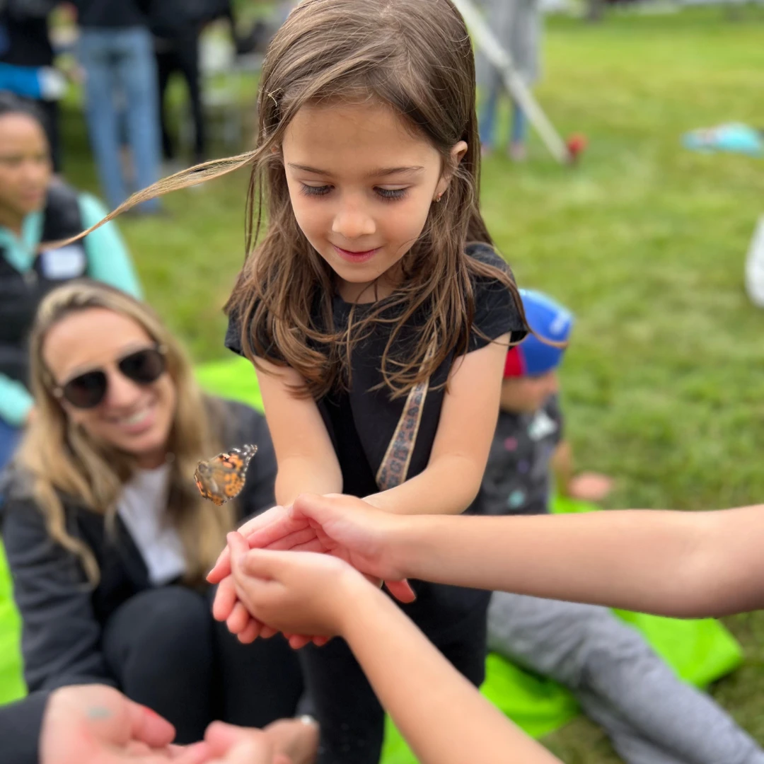 Camper releasing butterfly
