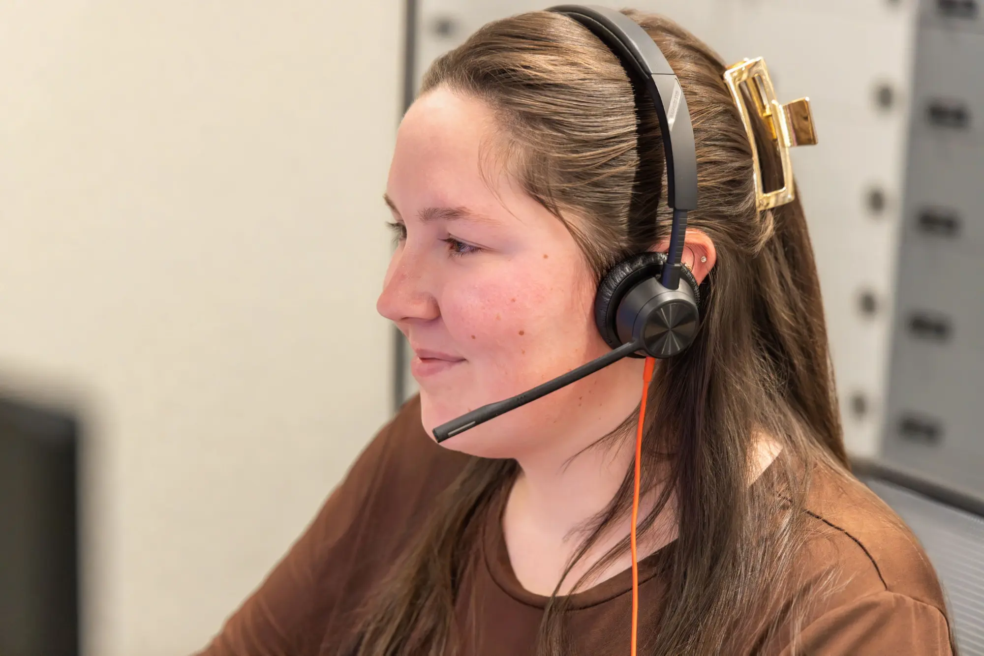 Social worker on the phone assisting people with cancer