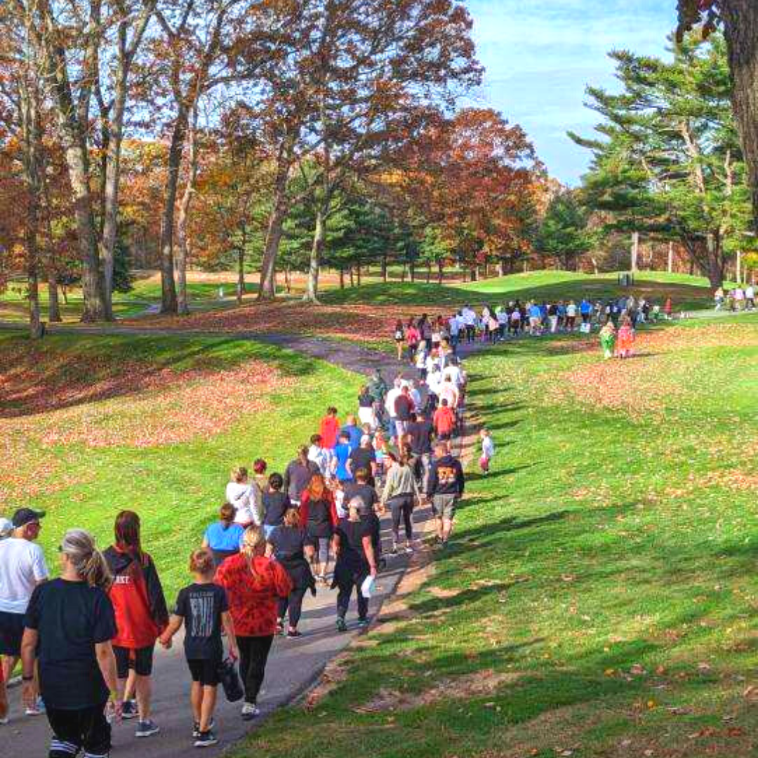 Participants walking down hill